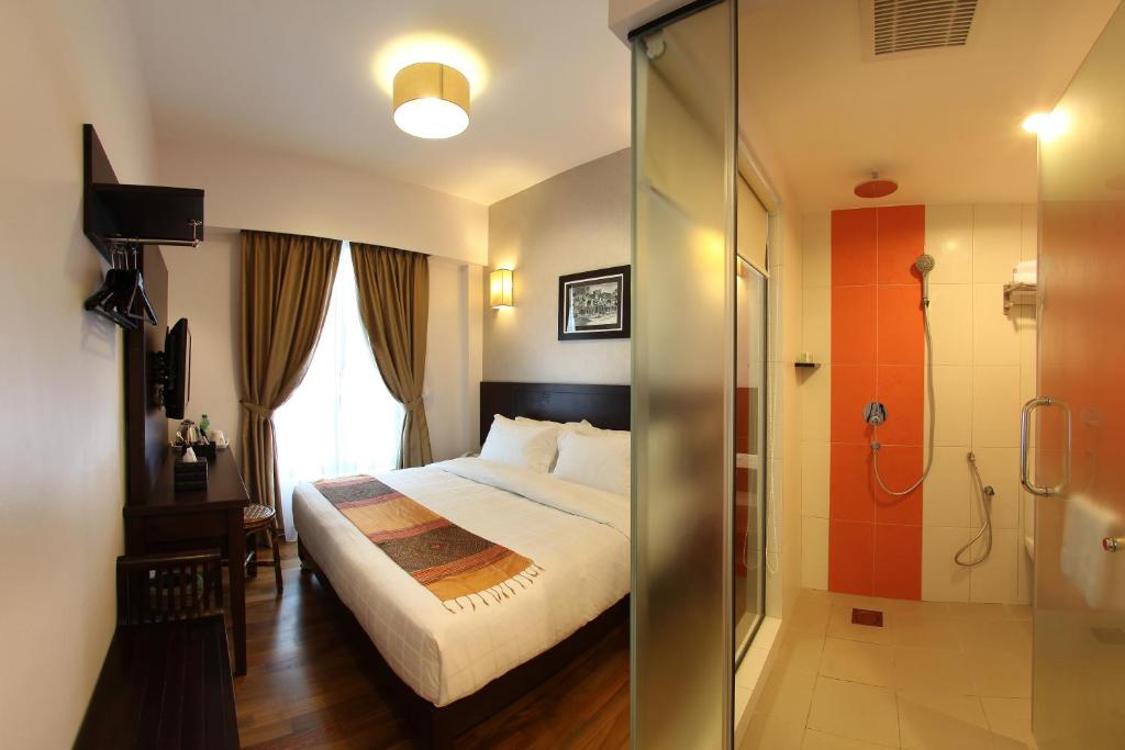 Postel nebo postele na pokoji v ubytování Hotel Richbaliz Selayang