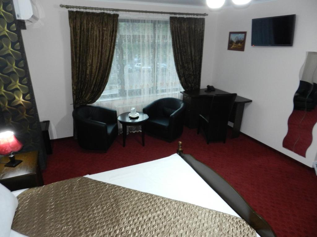 Postel nebo postele na pokoji v ubytování Hotel Marinii