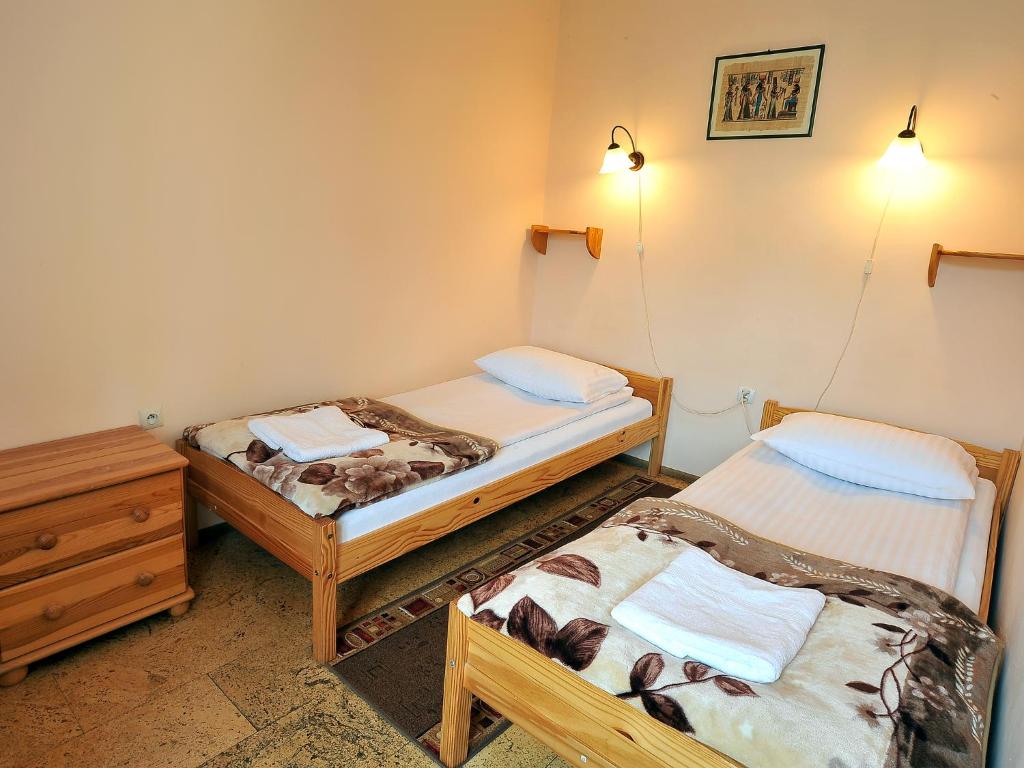 Postel nebo postele na pokoji v ubytování Villa Dom Julii