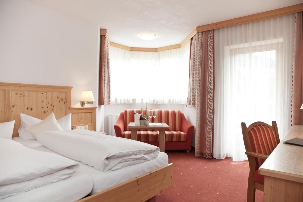 Postel nebo postele na pokoji v ubytování Hotel Troschana
