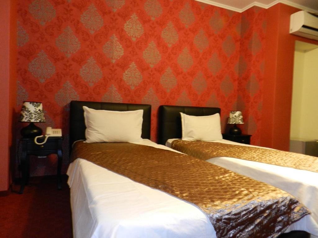 Postel nebo postele na pokoji v ubytování Hotel Marinii