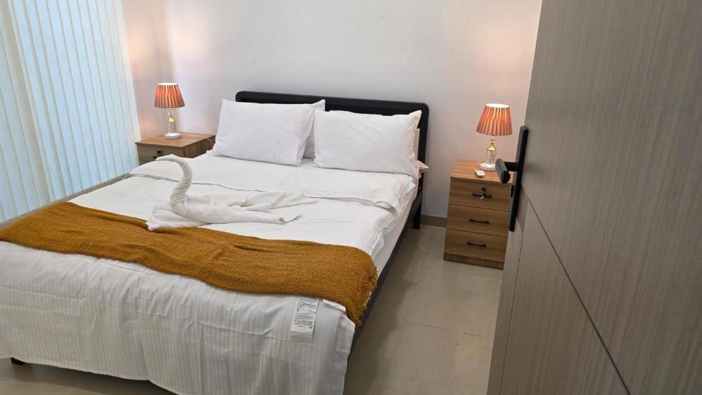 Ένα ή περισσότερα κρεβάτια σε δωμάτιο στο Sunset Villas