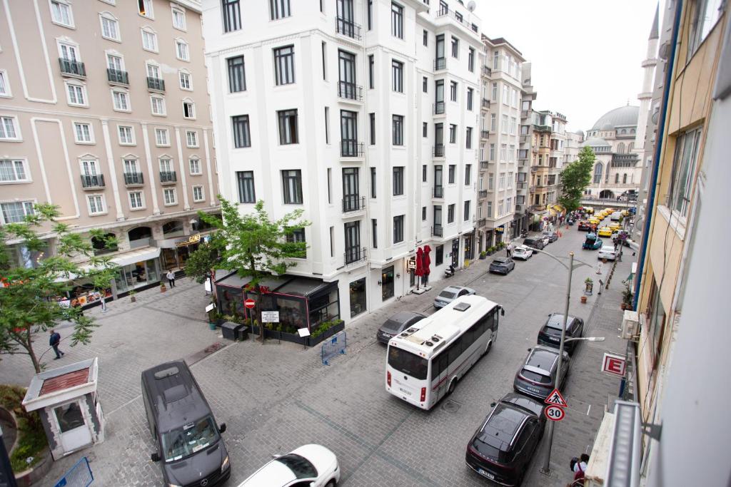 a busy city street with cars and a bus at Sultan Han Luxery Hotel in Istanbul