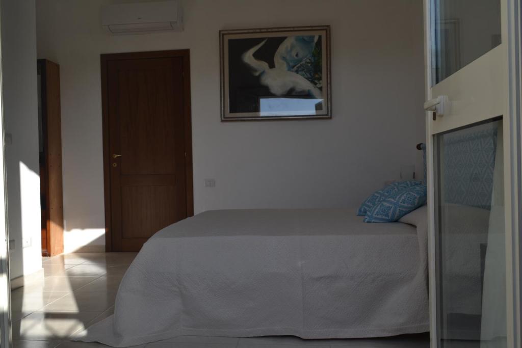 Postel nebo postele na pokoji v ubytování B&B l'Antropologo