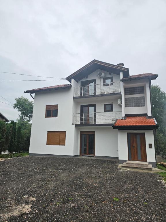 a white house with a black roof at Visoko Luxury Residence in Biskupići