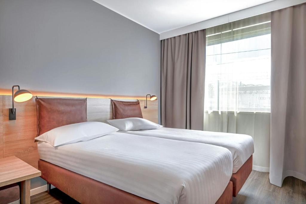 
Sleeper Twin Room with Two Twin Beds and Urban View
