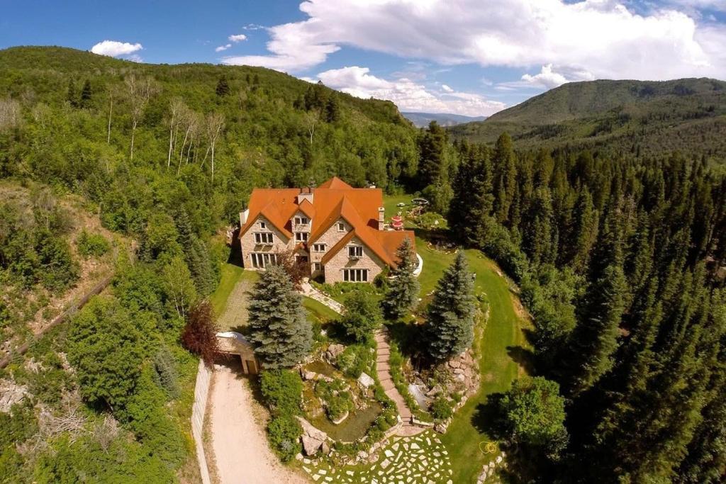 an aerial view of a large house in the mountains at Luxurious Mountain Retreat with Pool in Mound City