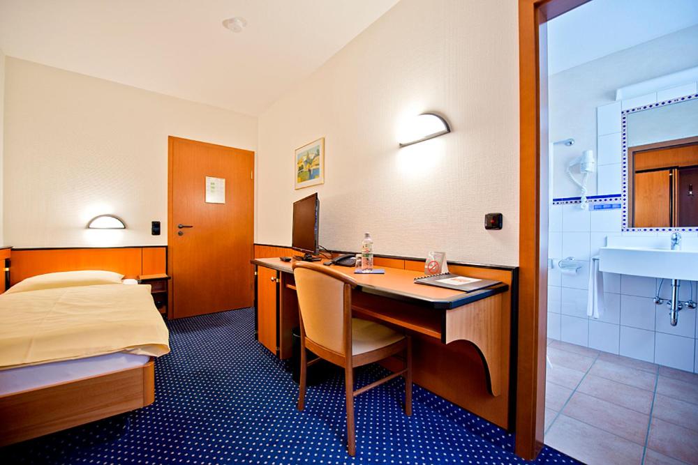 Postel nebo postele na pokoji v ubytování Panorama Hotel