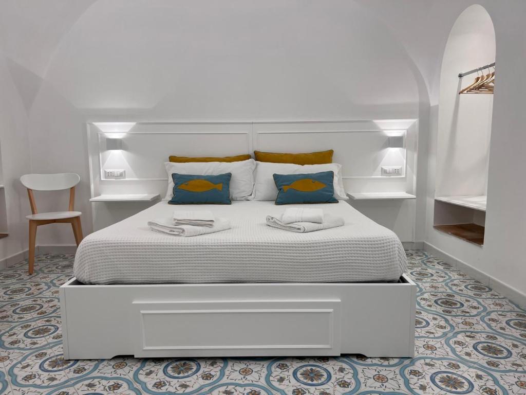 Ένα ή περισσότερα κρεβάτια σε δωμάτιο στο Casa Turchese Amalfi
