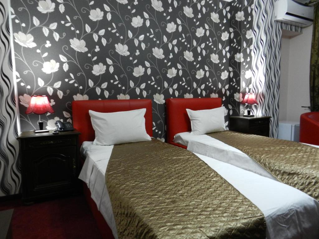 Postel nebo postele na pokoji v ubytování Hotel Marinii
