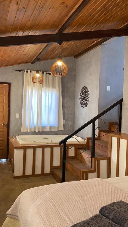 a bedroom with a bunk bed and a window at Chalés Lavras de Minas - Belém in Lavras Novas