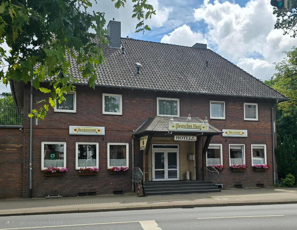 a brick building on the side of a street at Deutsches Haus in Buchholz in der Nordheide