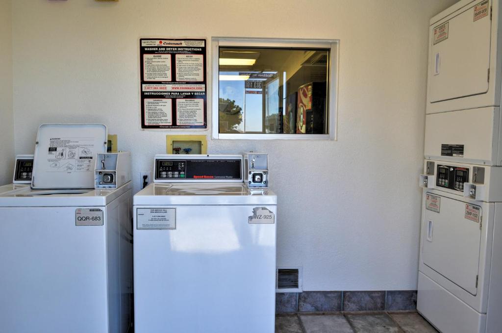 a kitchen with two refrigerators and a refrigerator at Motel 6-Santa Nella, CA - Los Banos - Interstate 5 in Santa Nella