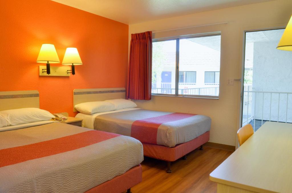 a hotel room with two beds and a window at Motel 6-Santa Nella, CA - Los Banos - Interstate 5 in Santa Nella