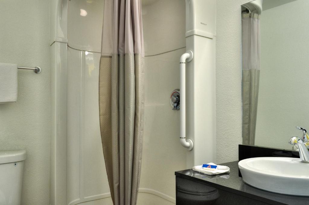 a bathroom with a shower and a sink at Motel 6-Santa Nella, CA - Los Banos - Interstate 5 in Santa Nella