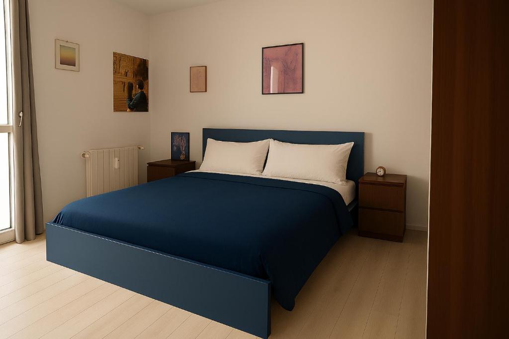 Ένα ή περισσότερα κρεβάτια σε δωμάτιο στο GioiApartment - B&B Scalo Romana Villaggio Olimpico