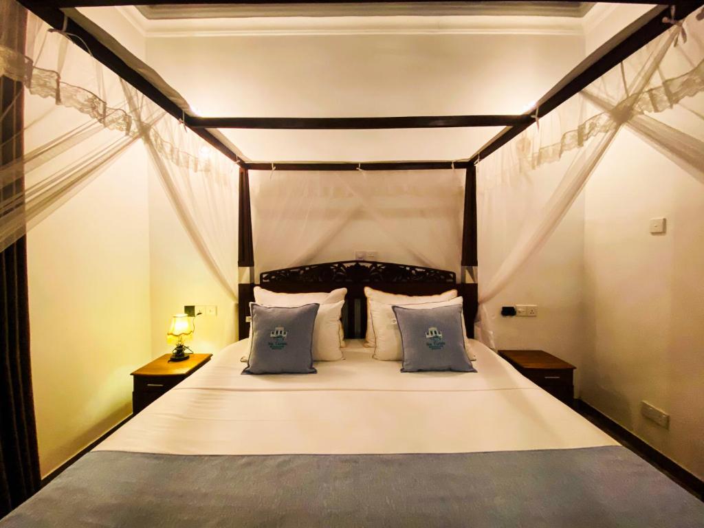 Ένα ή περισσότερα κρεβάτια σε δωμάτιο στο Sea Turtles Boutique Bungalow