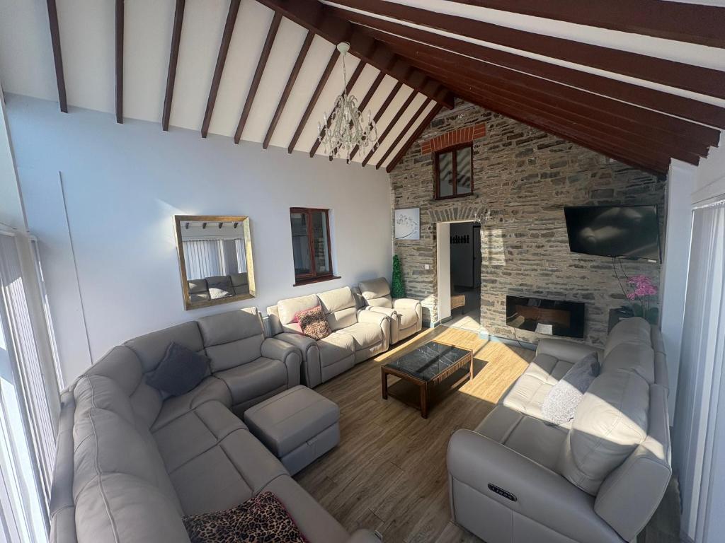 an overhead view of a living room with a couch and a fireplace at The Dairy in Aberystwyth