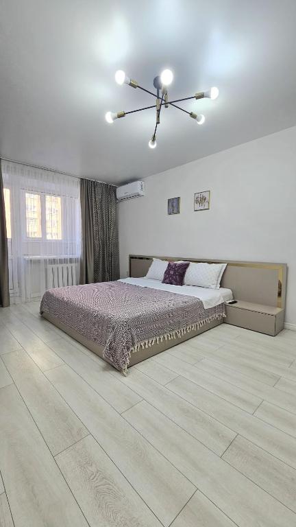 Ένα ή περισσότερα κρεβάτια σε δωμάτιο στο Мангилик Ел 10