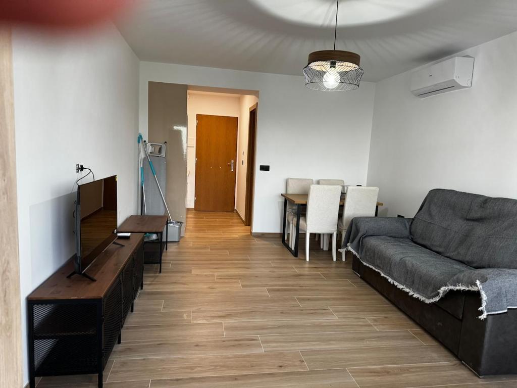 a living room with a couch and a table at Studio 200 m from the sea in Aguadulce