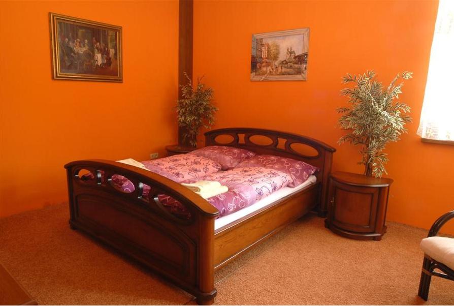 A bed or beds in a room at Apartmány Laverna