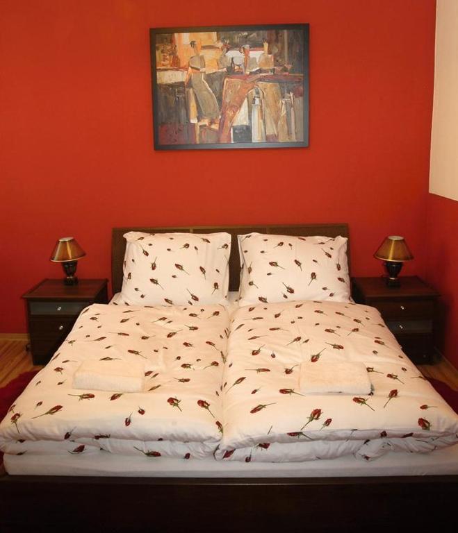A bed or beds in a room at Apartmány Laverna
