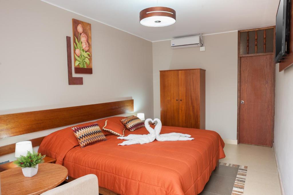 Postel nebo postele na pokoji v ubytování Hotel Curasi