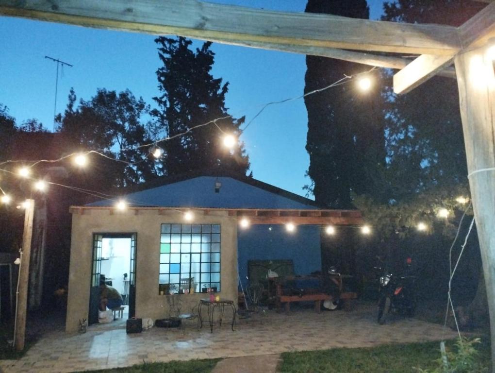 a patio with lights in front of a house at Quinta RASPANDO in La Reja