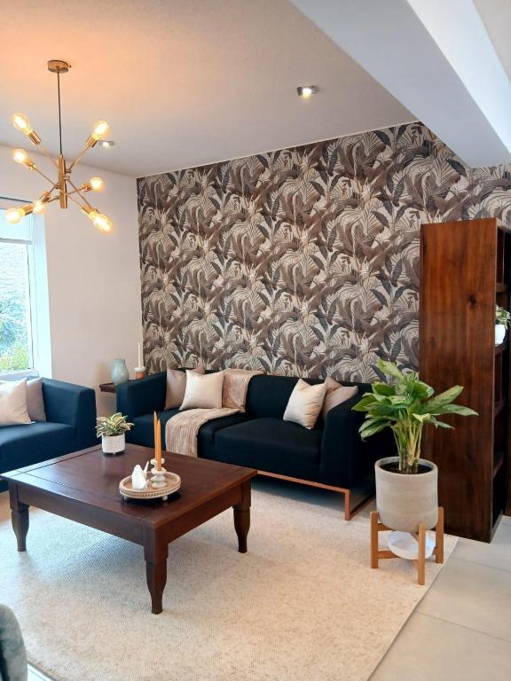 a living room with a couch and a table at Duplex Premium Cayma Céntrico in Cayma