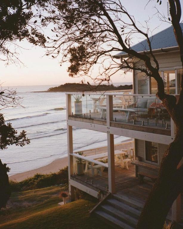 a house on the beach with a view of the ocean at Bay Properties The Beach House in Yamba
