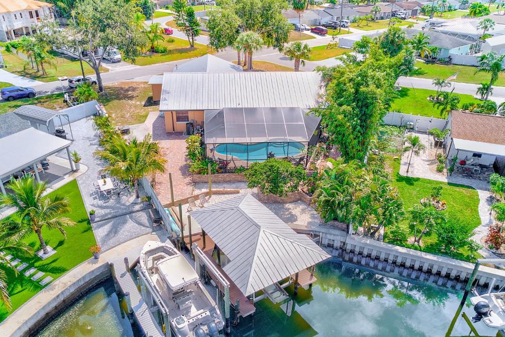 an aerial view of a house with a swimming pool at Sunset Cove Apollo Beach in Apollo Beach