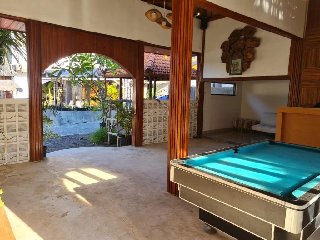 a pool room with a pool table in a house at BBC Suites and Garden in Uluwatu