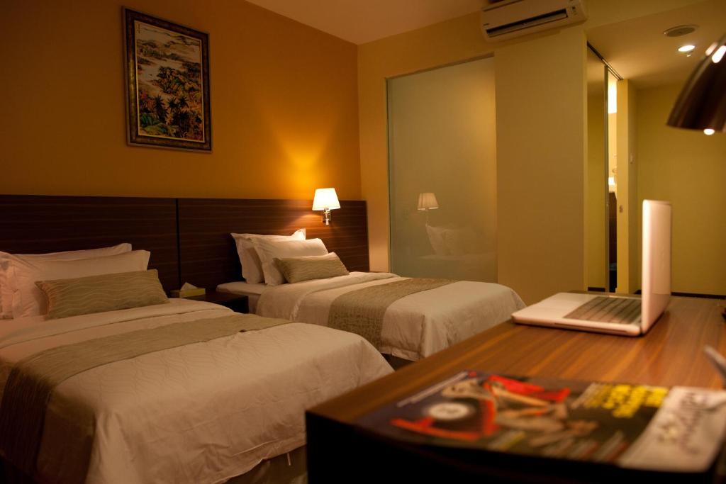 Postel nebo postele na pokoji v ubytování Pine Tree Hotel