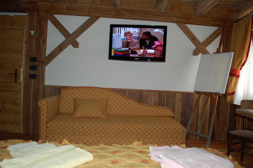 TV a/nebo společenská místnost v ubytování Residenza La Corte Dei Toldi