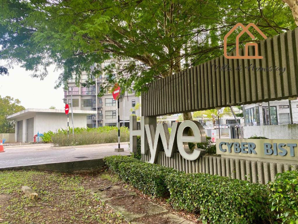 a sign on a building that says we at ImpianKU at HYVE SOHO Cyberjaya - 2BR - Wifi in Cyberjaya
