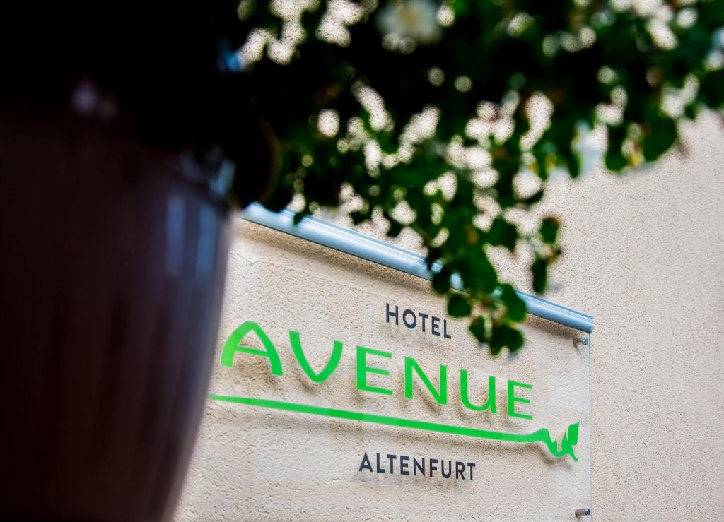 a street sign for a hotel avenille at Hotel Avenue Altenfurt in Nuremberg