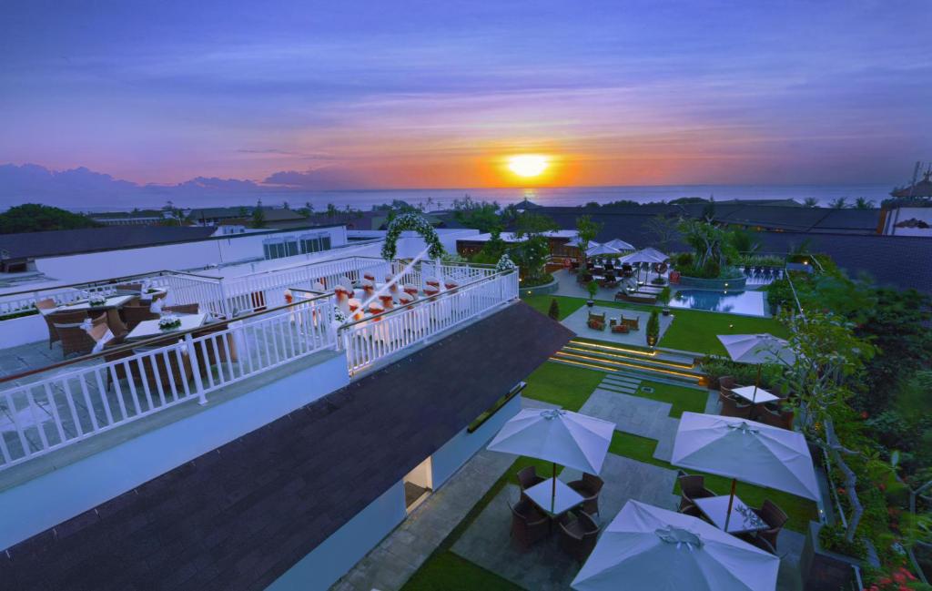 an aerial view of a resort with a sunset at favehotel Kuta Kartika Plaza in Kuta