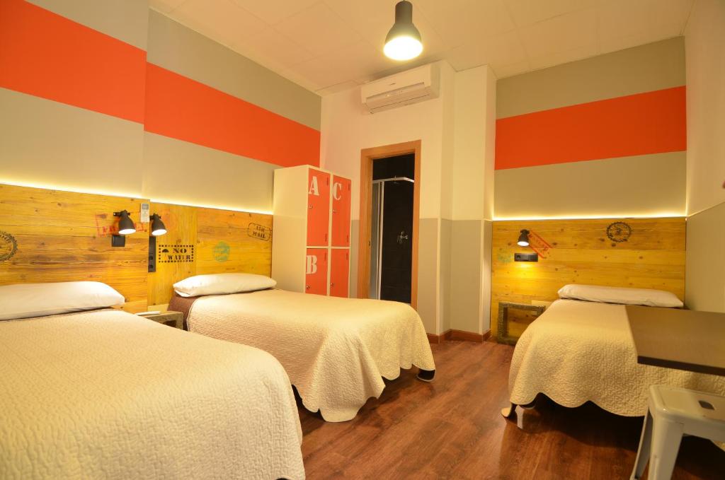 Cama o camas de una habitación en Far Home Atocha