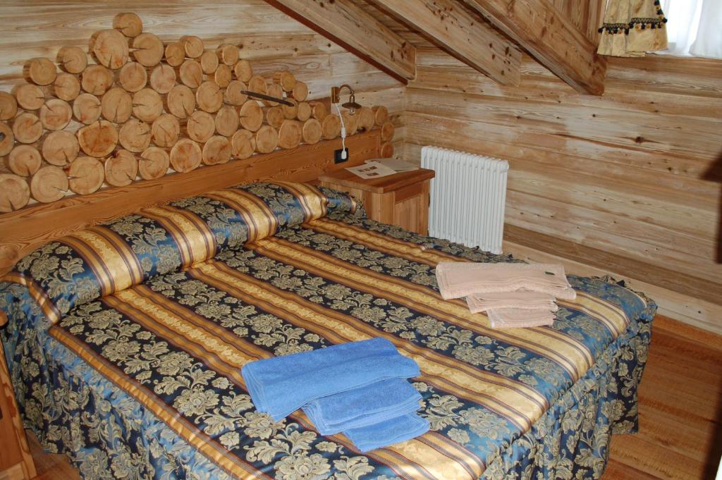 Postel nebo postele na pokoji v ubytování Residenza La Corte Dei Toldi