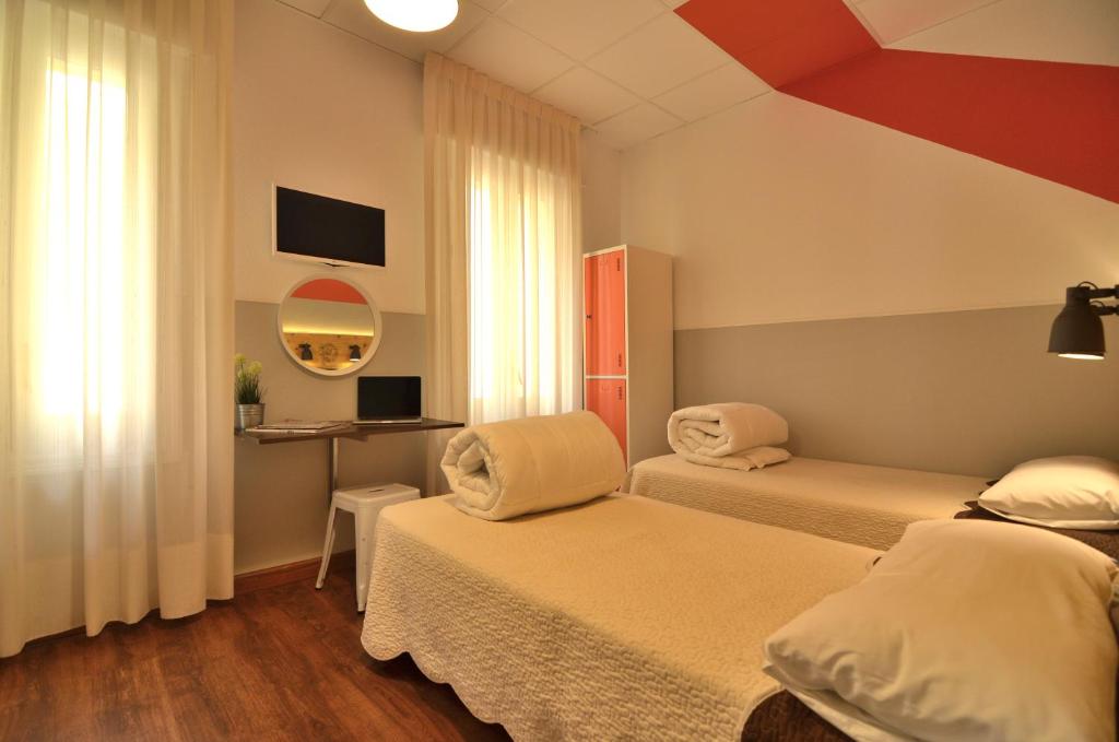 Cama o camas de una habitación en Far Home Atocha