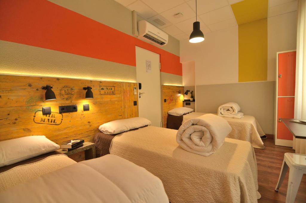 Cama o camas de una habitación en Far Home Atocha
