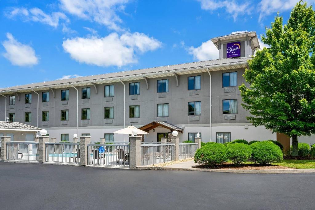 a building with a clock tower on top of it at Sleep Inn Boone University Area in Boone