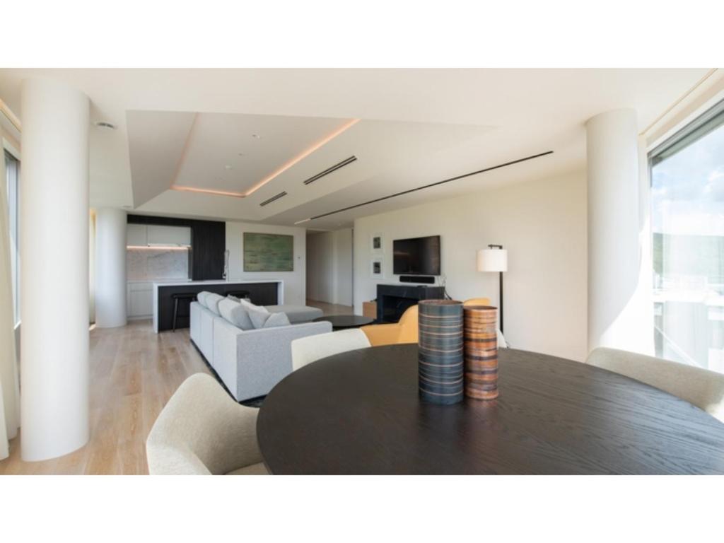 a dining room and living room with a table at Skye Niseko - Vacation STAY 33471v in Niseko
