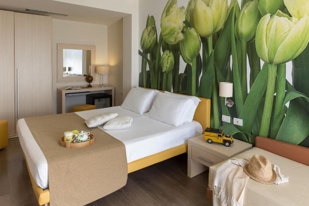 Postel nebo postele na pokoji v ubytování Hotel Acquadolce