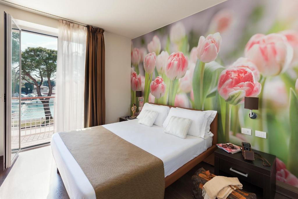 Postel nebo postele na pokoji v ubytování Hotel Acquadolce