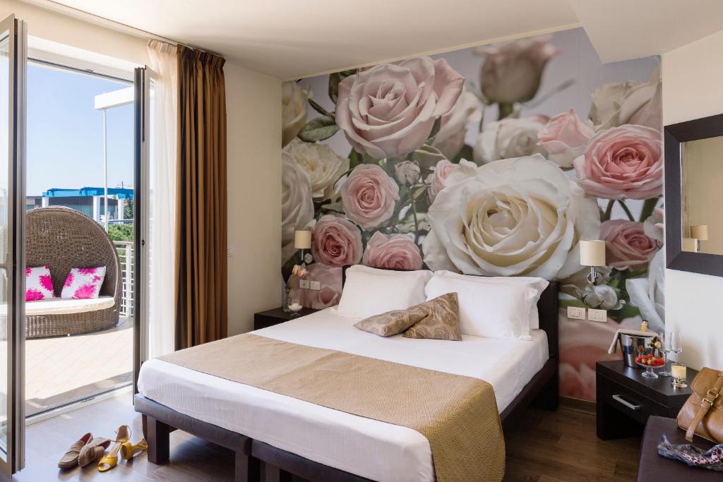 Postel nebo postele na pokoji v ubytování Hotel Acquadolce