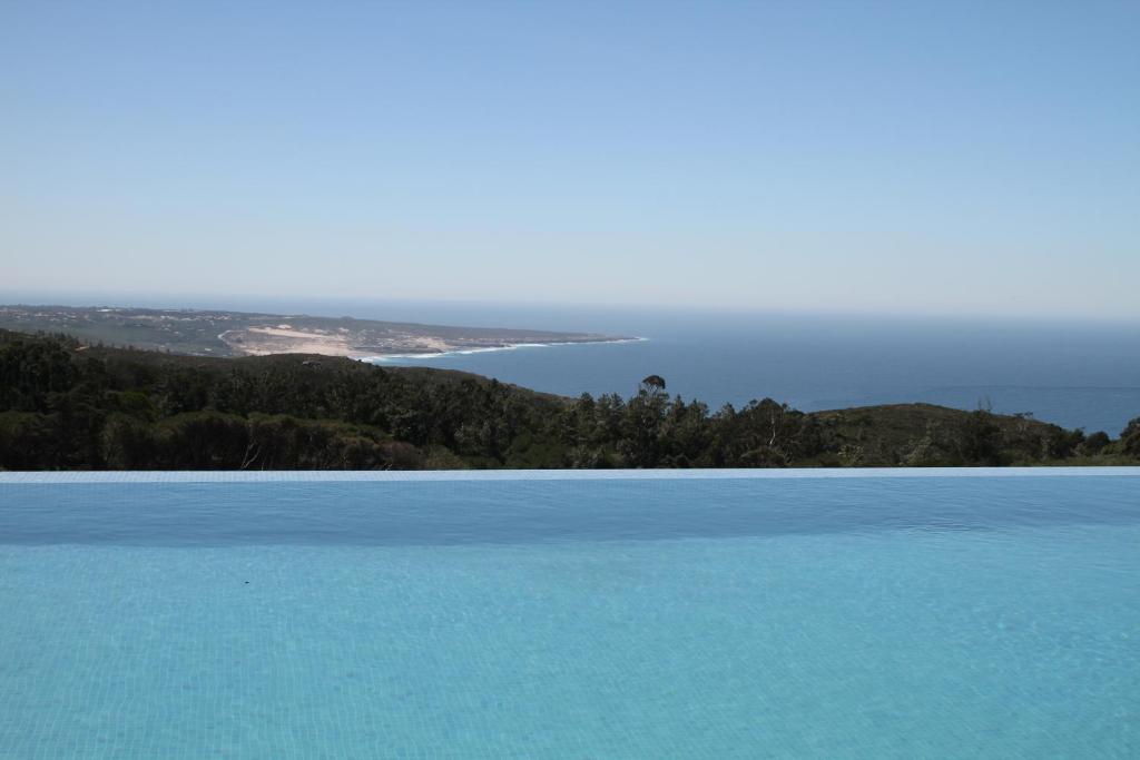 a view of a large body of blue water at Quinta Vale da Roca in Sintra