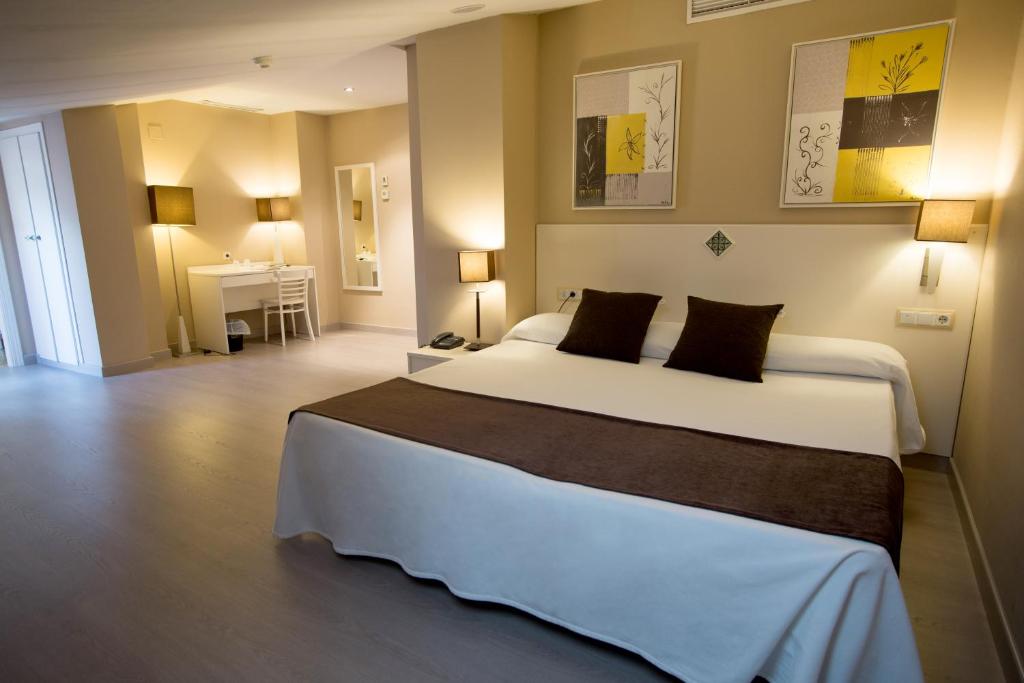 Postel nebo postele na pokoji v ubytování Hotel Torico Plaza