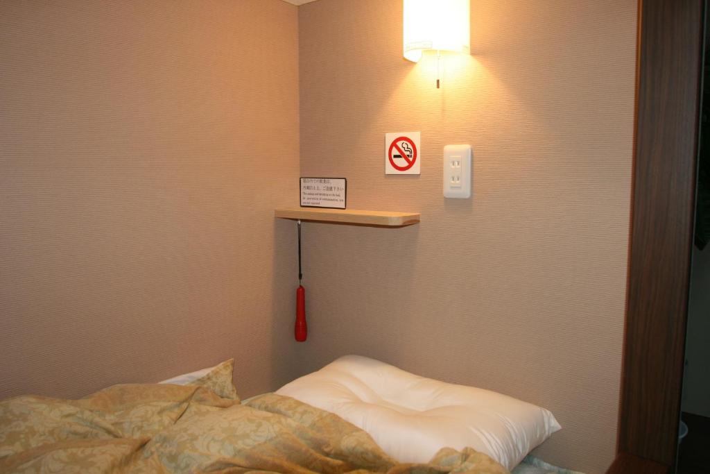 Postel nebo postele na pokoji v ubytování Guesthouse Haru Kitamachi