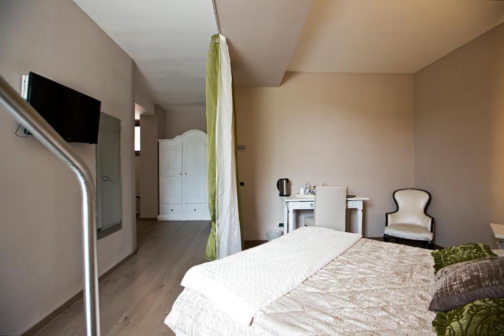 Postel nebo postele na pokoji v ubytování Hotel Tiro a Volo
